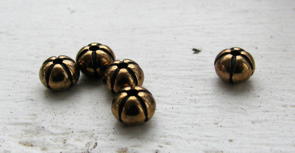 Mellandel Bronsfärgad - Rund pumpa 6x4,6mm, 5-pack Grekisk Metall