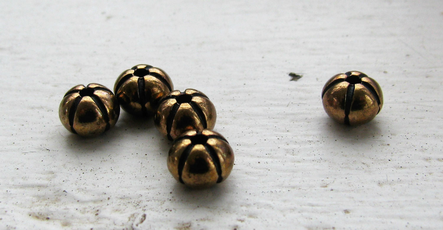 Mellandel Bronsfärgad - Rund pumpa 6x4,6mm, 5-pack Grekisk Metall