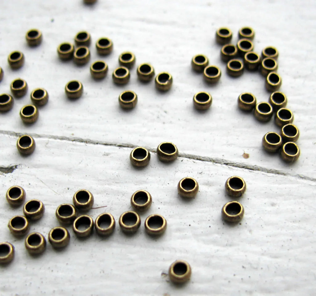 Klämpärlor - Bronsfärgade 2 mm (50-pack) Grekisk Metall