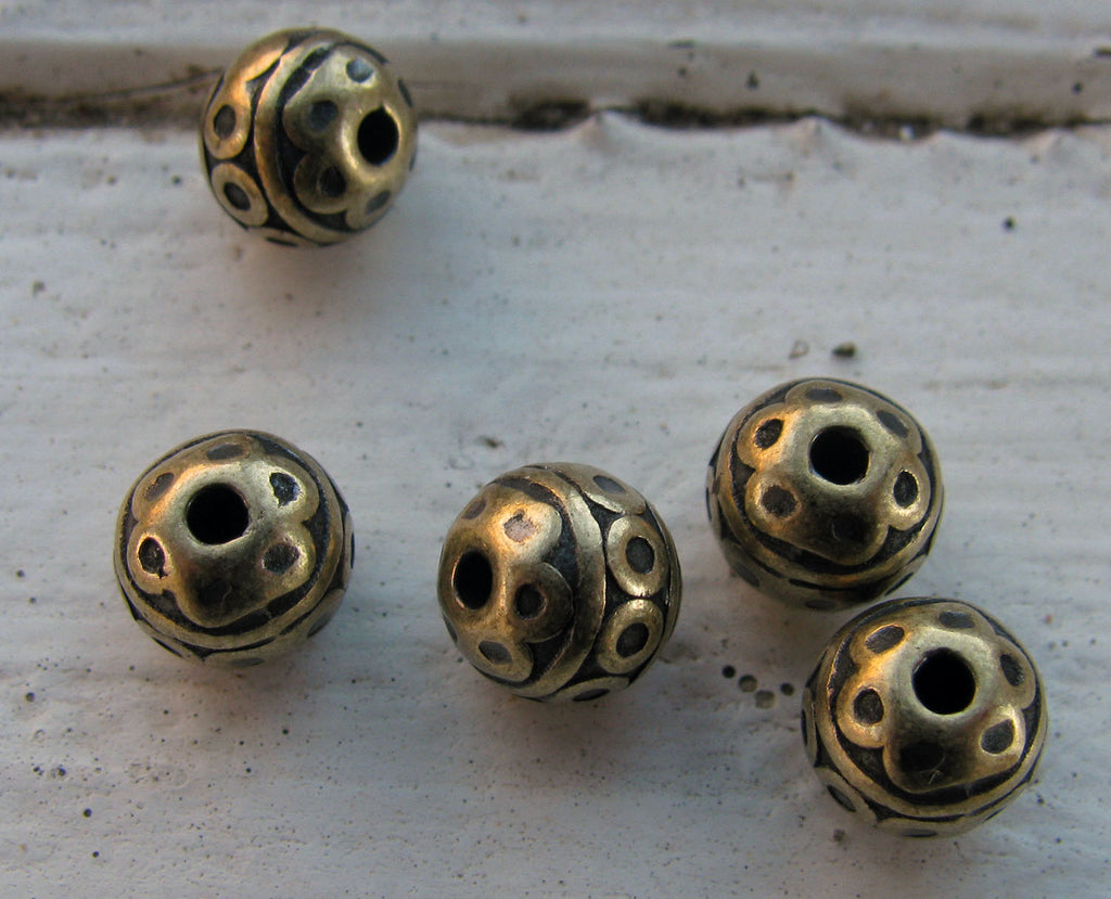 Mellandel bronsfärgad - Rund med cirklar 7mm 5-pack Grekisk Metall