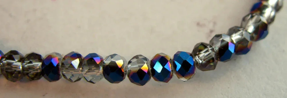 Facetterade glaspärlor - Klar/Olja, 3x2mm, 1 sträng Hilmas Pyssel