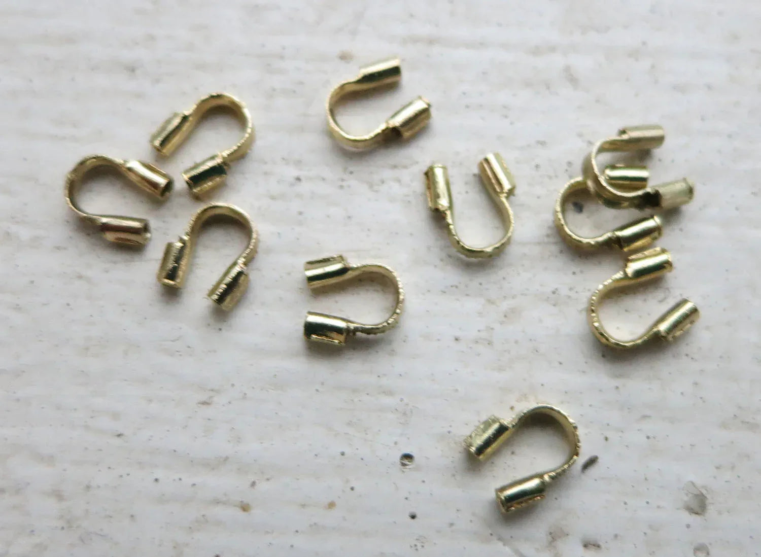 Wireguard - Guldfärgad 0,56mm 10-pack Grekisk Metall