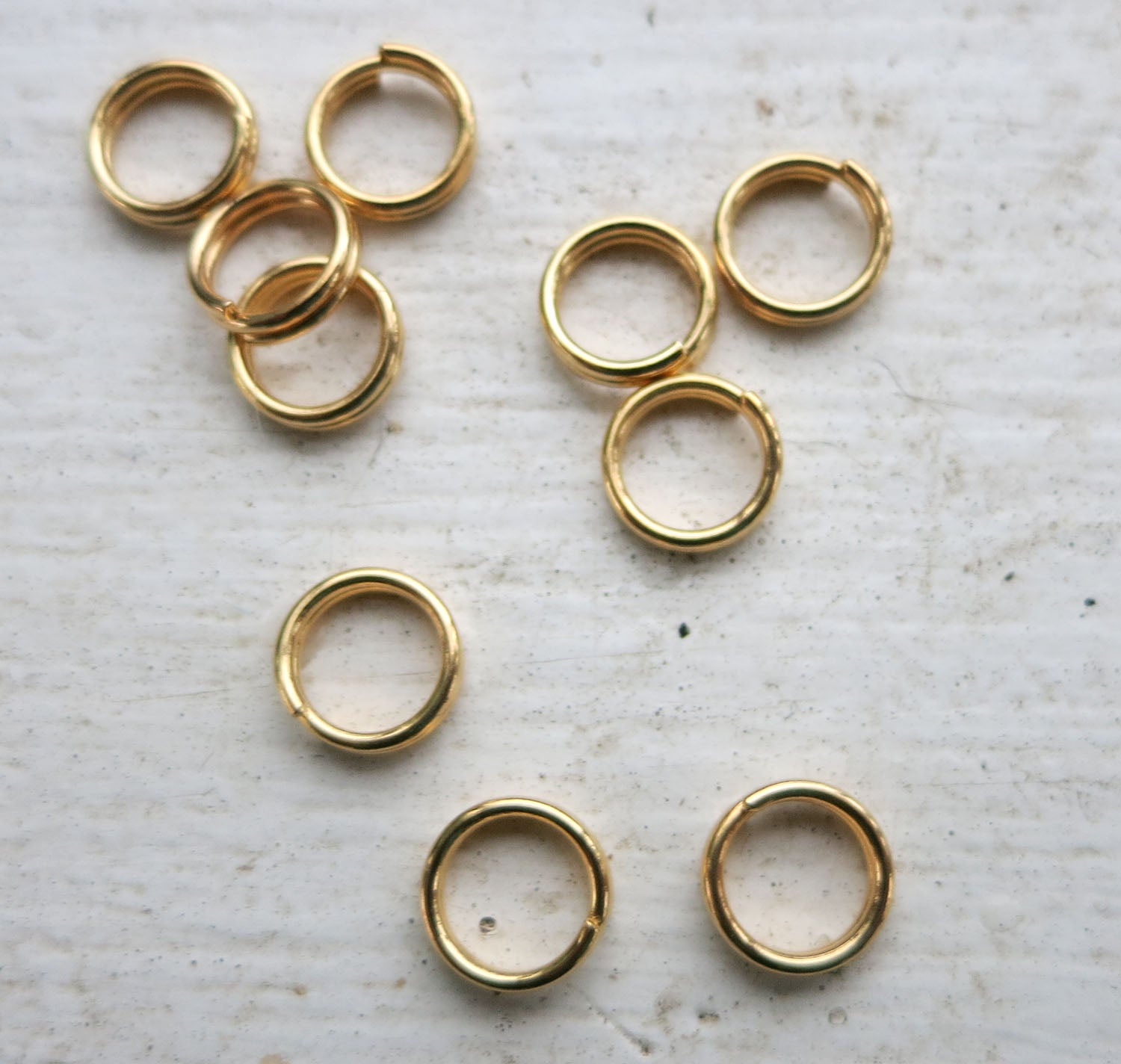 Motringar - Guldfärgade 7mm 10-pack Grekisk Metall