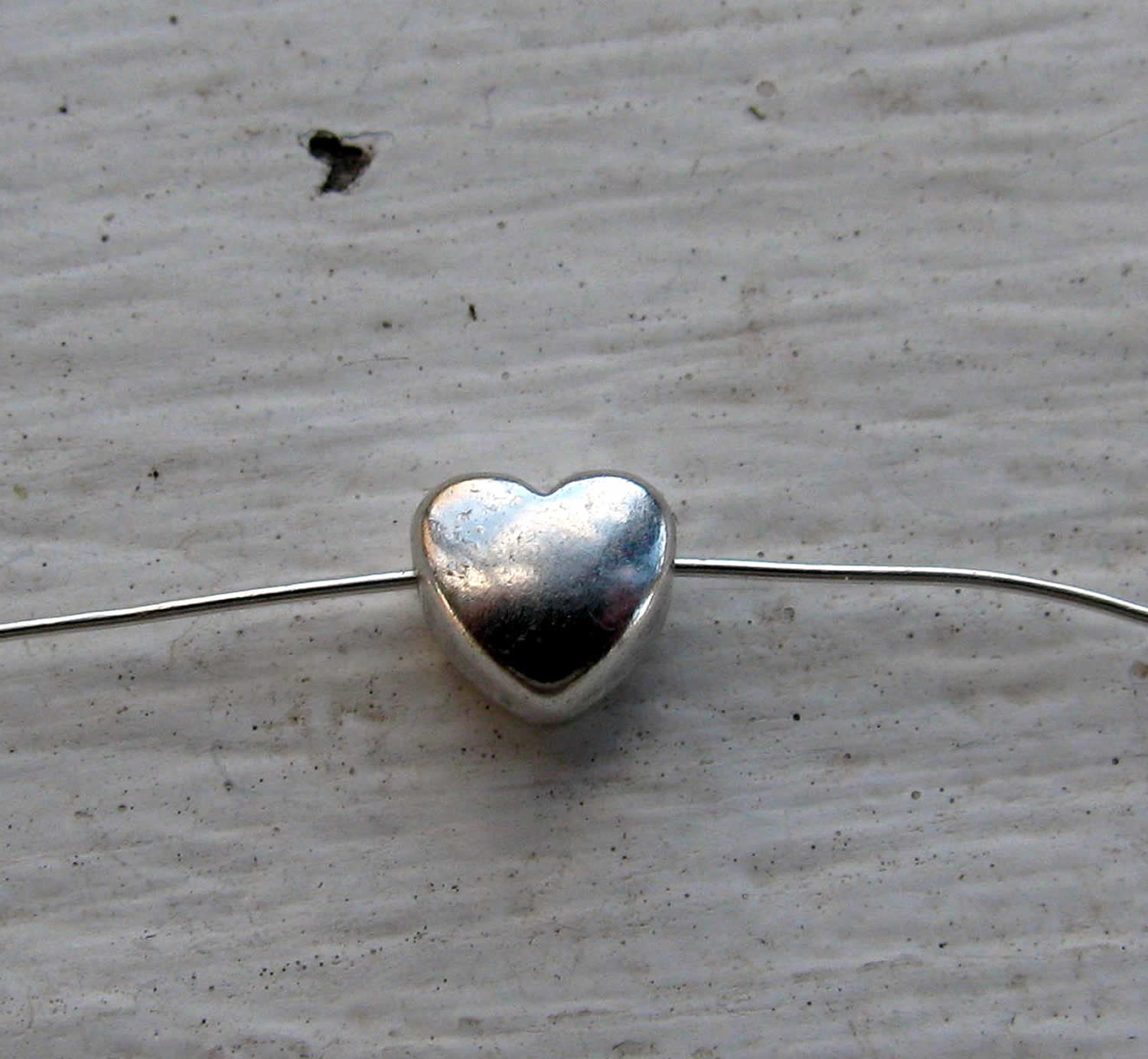 Mellandel Silverpläterad - Mindre bulligt hjärta, 6mm, 10-pack Grekisk Metall