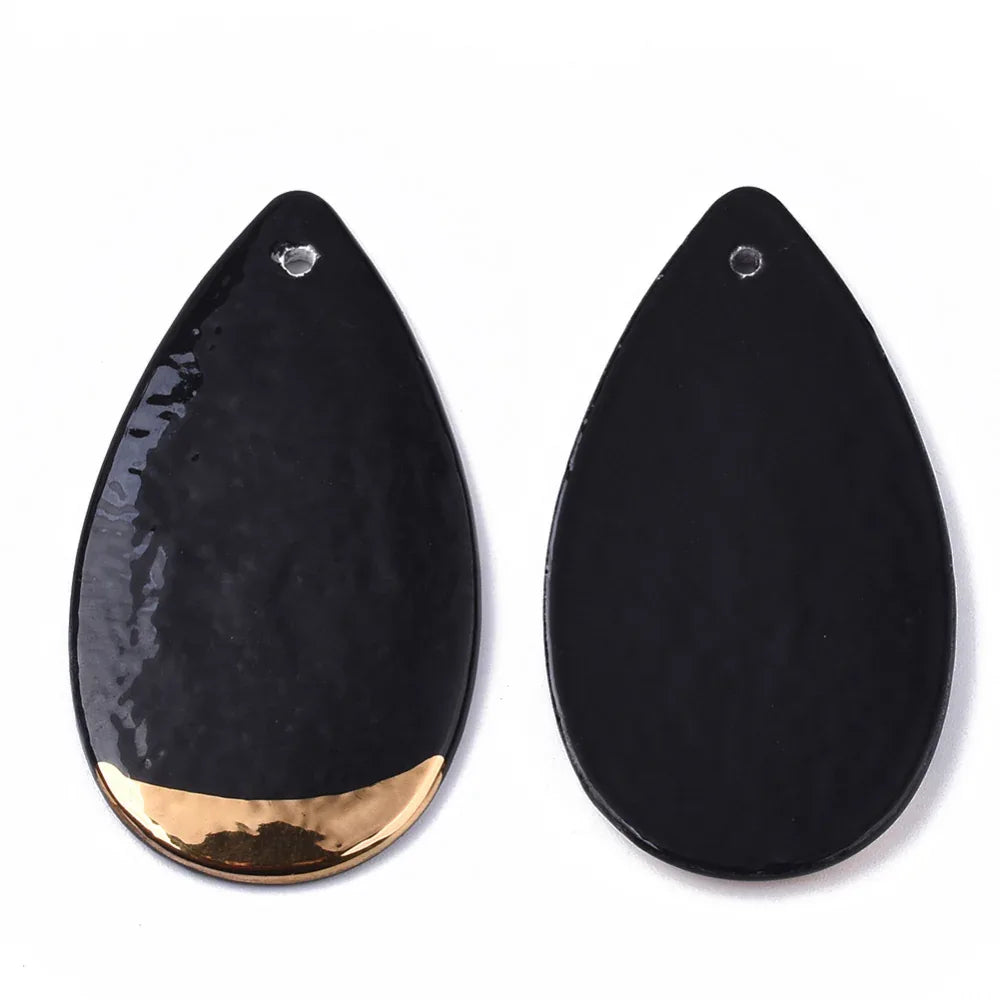 Hänge i porslin - Droppe Svart med guld 50x27mm 1 styck Hilmas Pyssel