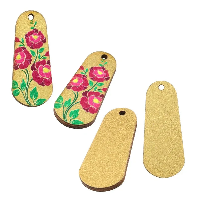 Hänge / Berlock Trä - Oval med blommor, guld 15x36mm 1 styck Hilmas Pyssel