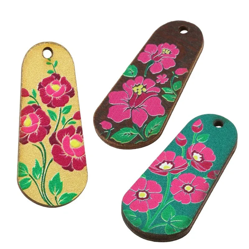 Hänge / Berlock Trä - Oval med Blommor, Petrol 15x36mm 1 styck Hilmas Pyssel