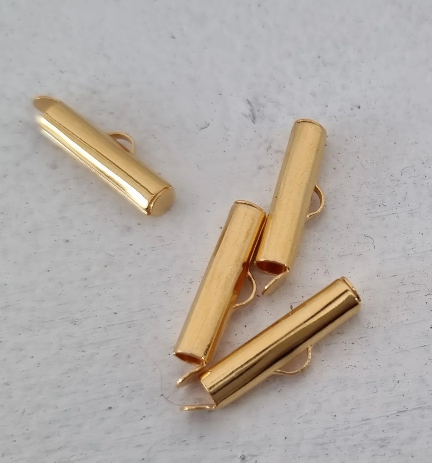 Avslut Guldfärgad - Slide tube 20mm 4-pack Grekisk Metall