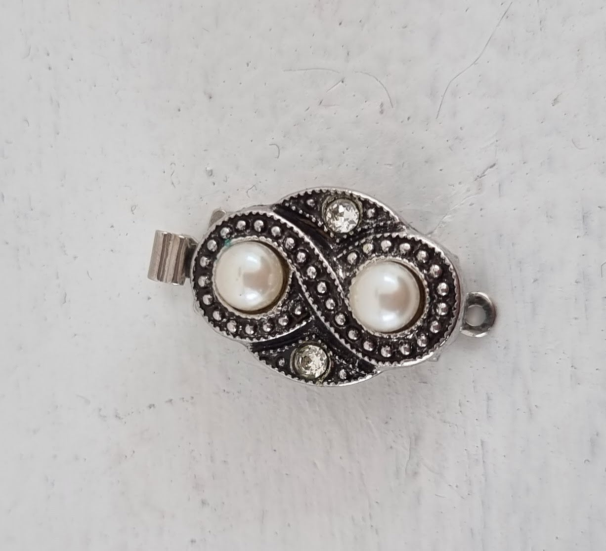 Instickslås - Oval spiral silverfärgad 17x12mm 1 styck Hilmas Pyssel