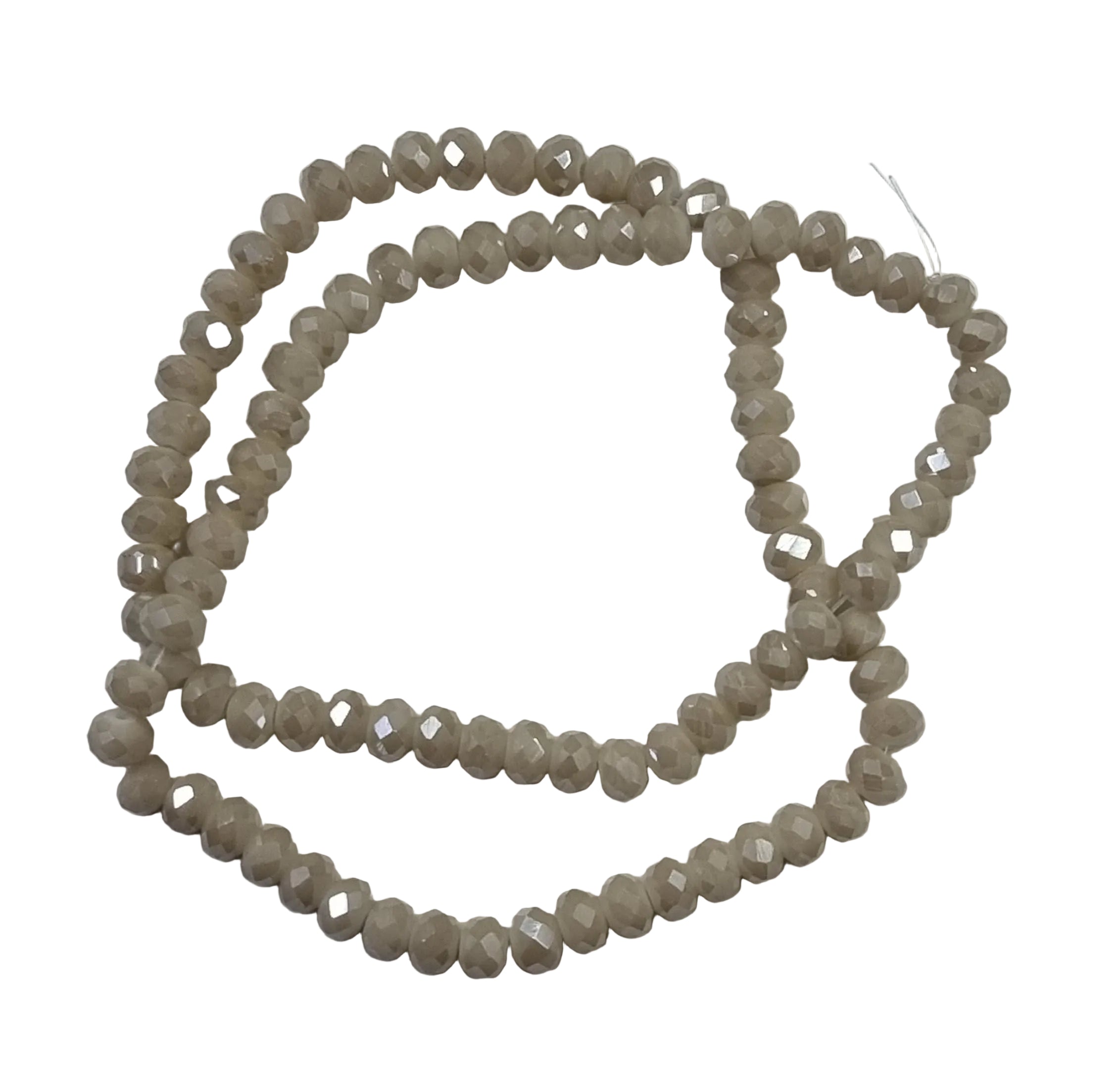 Facetterade glaspärlor - Opak beige AB, 6x4mm 1 sträng