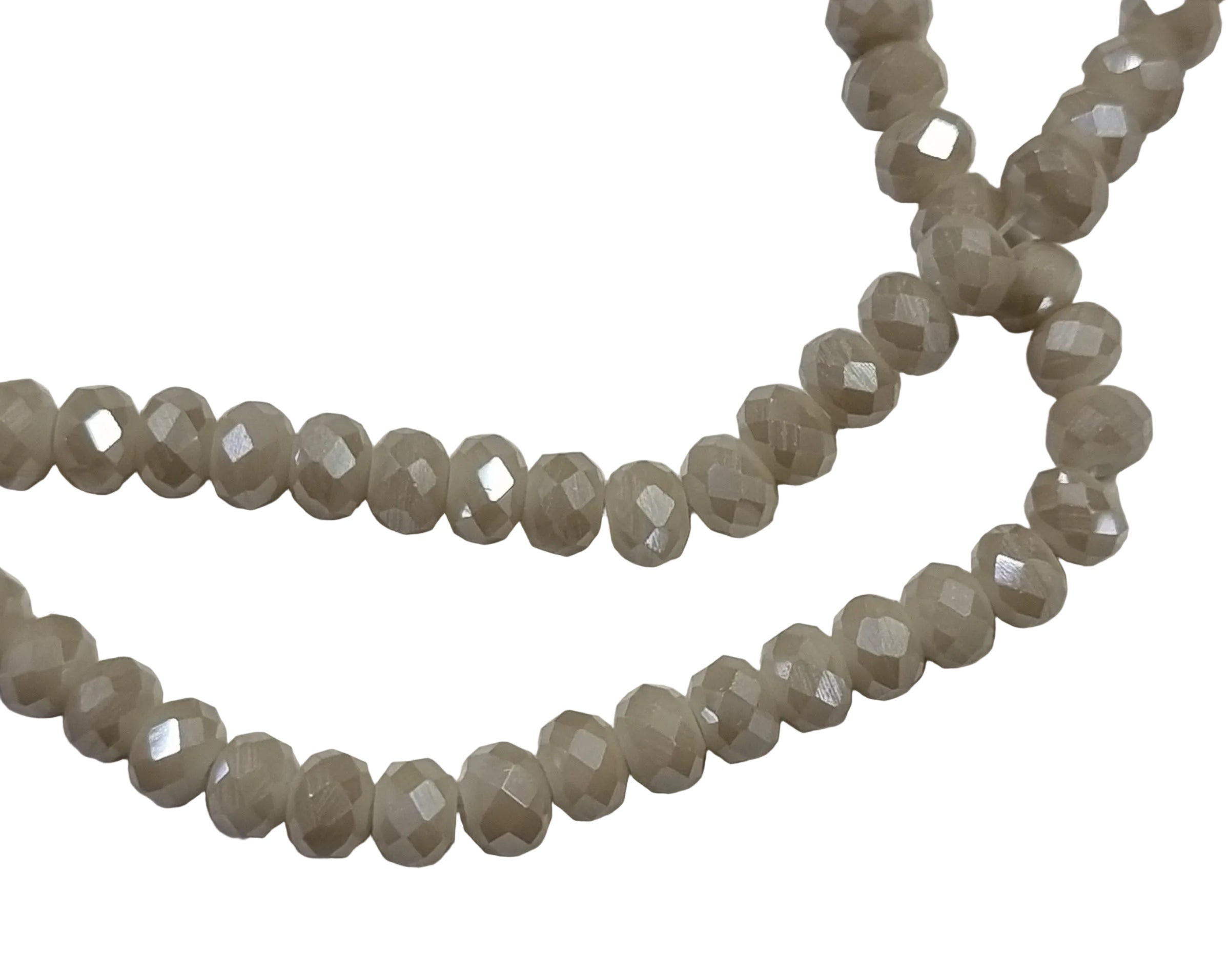 Facetterade glaspärlor - Opak beige AB, 6x4mm 1 sträng