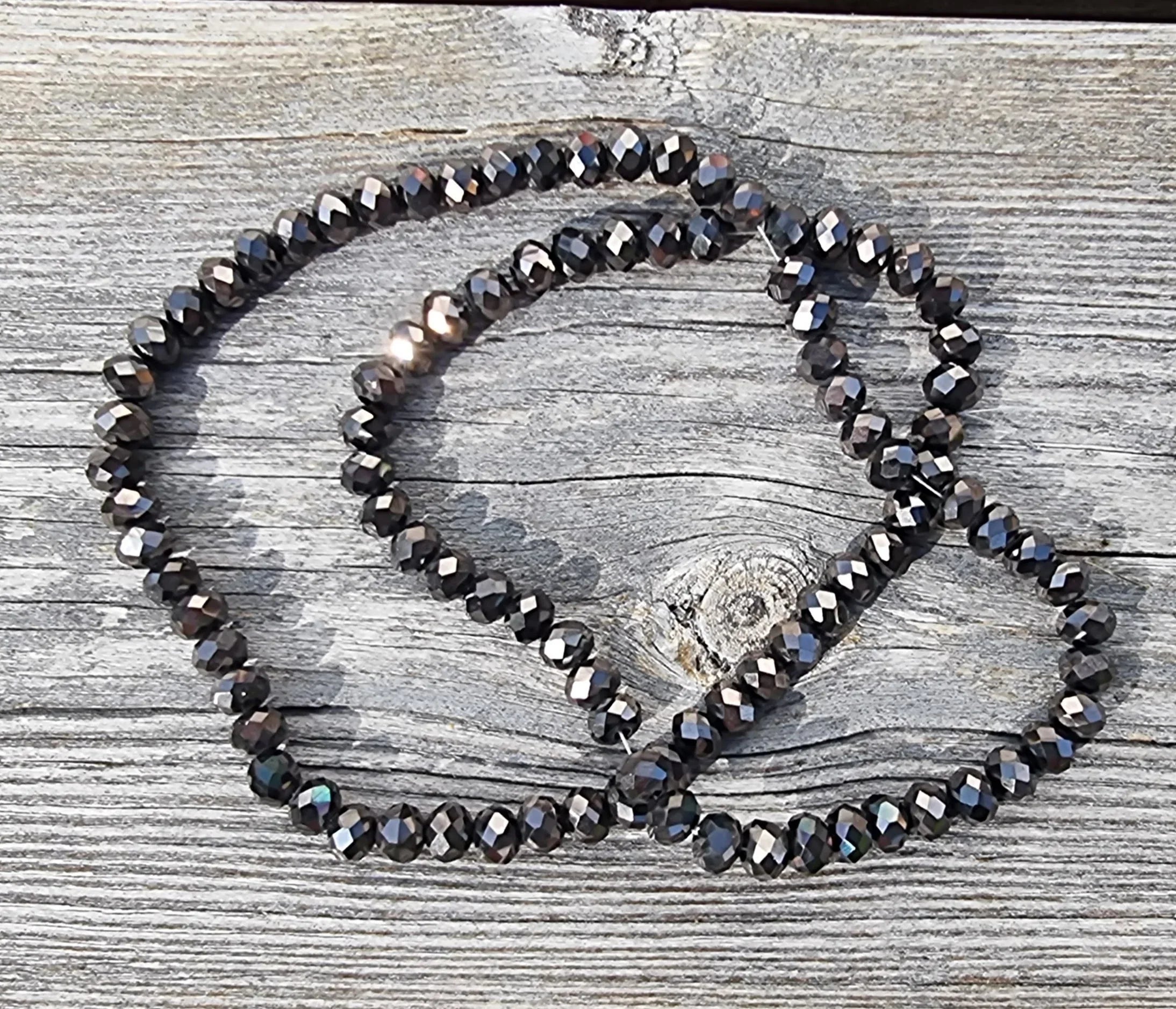 Facetterade glaspärlor - Elektropläterade gunmetalfärgade, 6x4mm 1 sträng Hilmas Pyssel