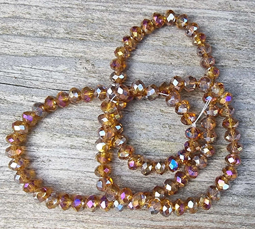Facetterade glaspärlor - Topaz med AB lyster, 6x4mm 1 sträng Hilmas Pyssel