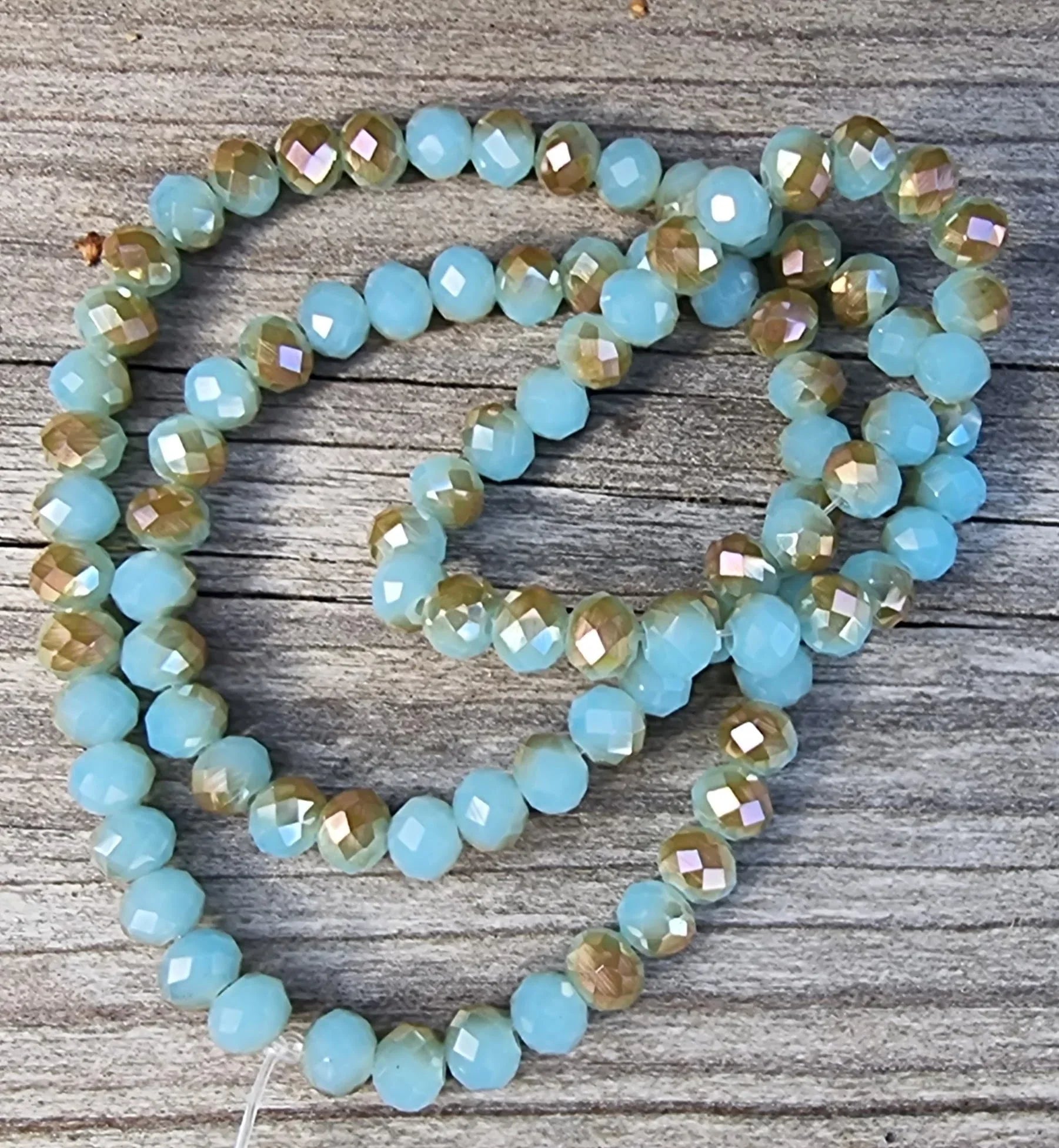 Facetterade glaspärlor - Turkos/brun med skimmer, 6x4mm 1 sträng Hilmas Pyssel