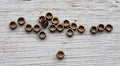 Mellandel Bronsfärgad - Mini rondell 2x0.8mm 20-pack Grekisk Metall