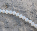 Tjeckiska MC Bicone - White Opal 4 mm, 1 sträng Preciosa