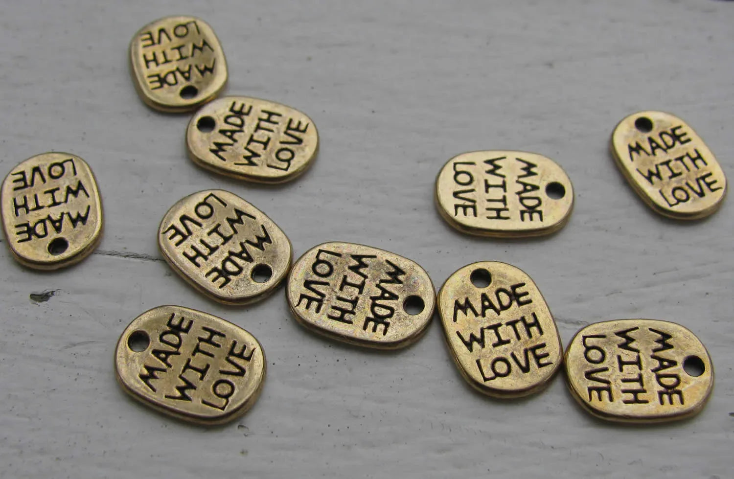 Berlock bronsfärgad - Oval 'Made with love', 10-pack Grekisk Metall