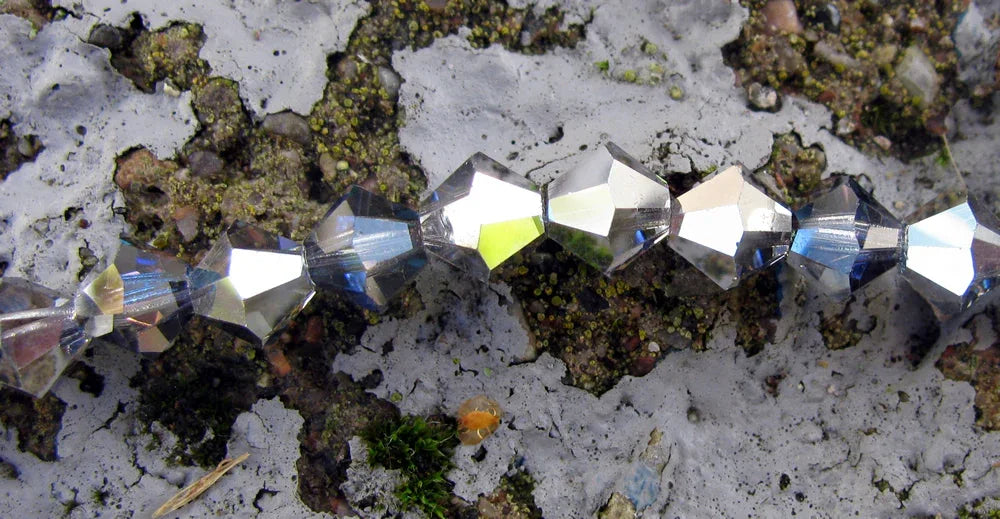 Tjeckiska MC Bicone - Crystal Heliotrope 6 mm, 1 sträng Preciosa