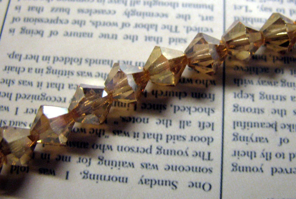 Tjeckiska MC Bicone - Crystal Golden Flare 6 mm, 1 sträng Preciosa