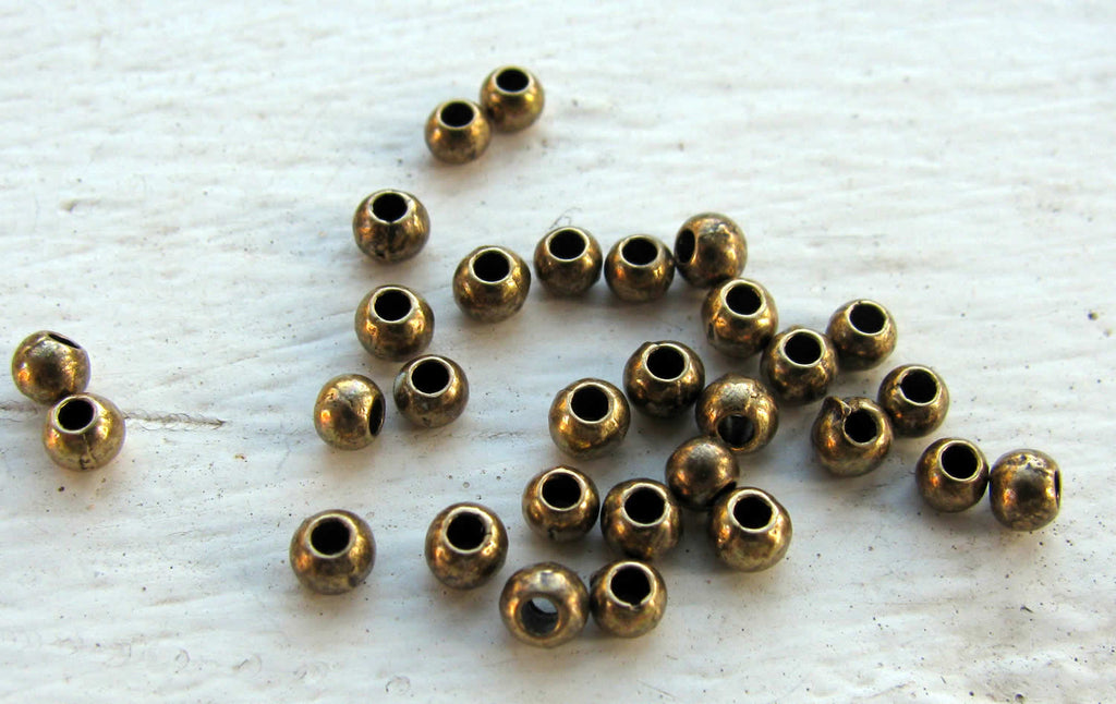 Mellandel bronsfärgad - Rund 3 mm, 30-pack Grekisk Metall