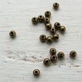 Mellandel Bronsfärgad - Rund 4mm 20-Pack Grekisk Metall