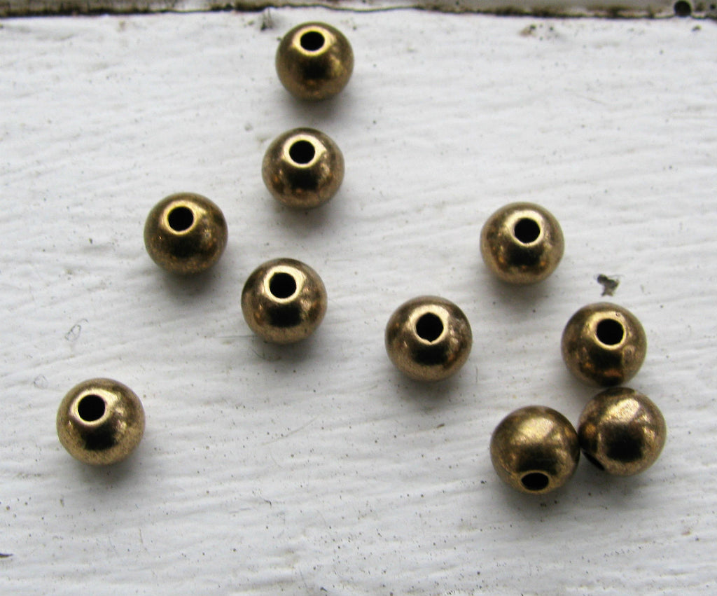 Mellandel bronsfärgad - Rund 6 mm, 10-pack Grekisk Metall