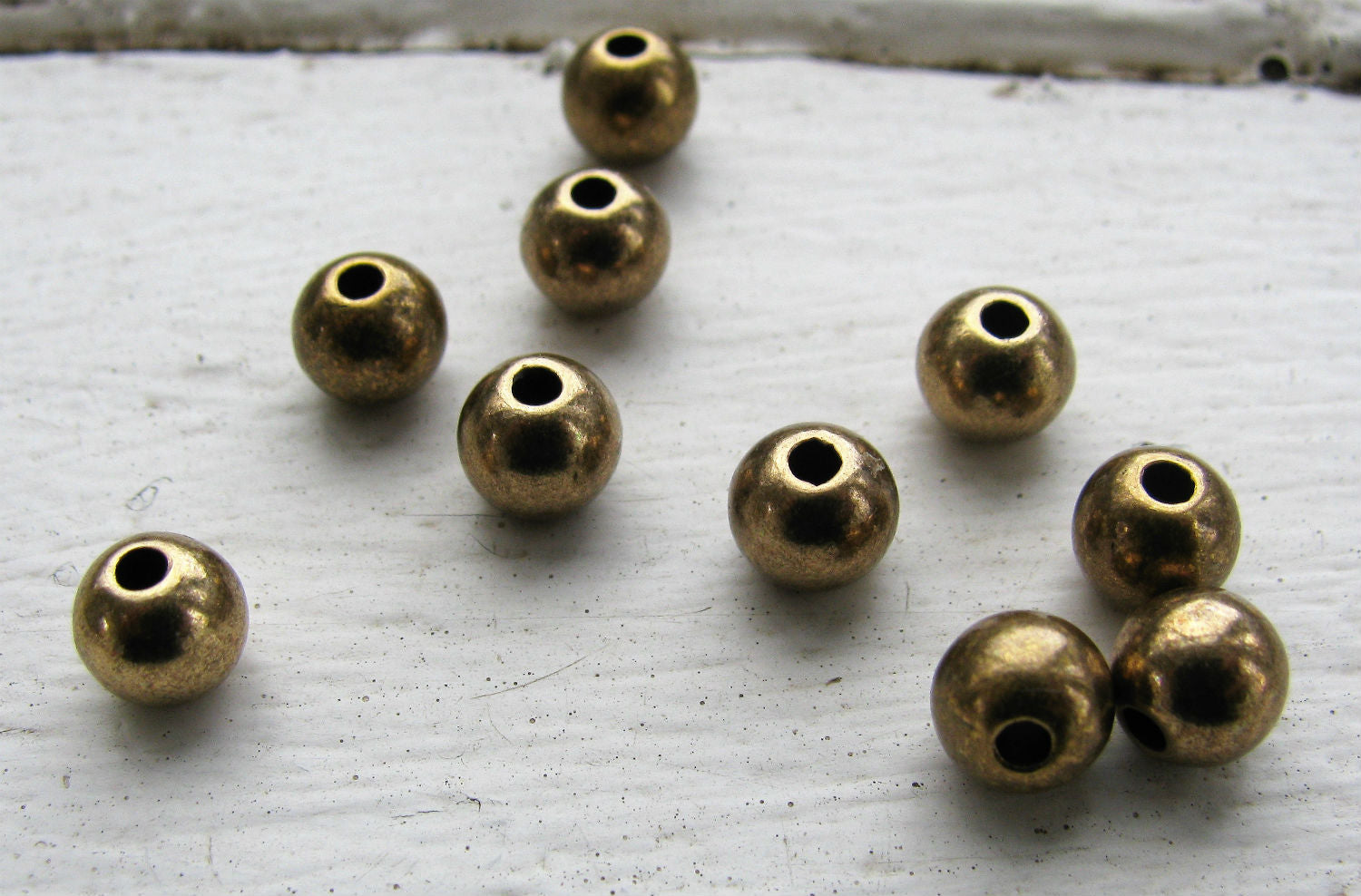 Mellandel bronsfärgad - Rund 6 mm, 10-pack Grekisk Metall