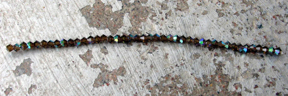 Tjeckiska MC Bicone - Smokey Topaz AB 3 mm, 40- pack Preciosa