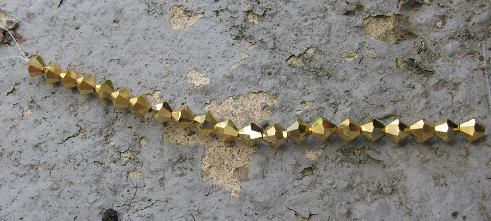 Tjeckiska MC Bicone - Crystal Aurum 6 mm, 1 sträng Preciosa