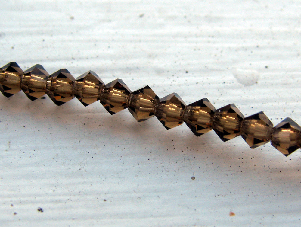 Tjeckiska MC Bicone - Smoked Topaz, 3 mm - 1 sträng Preciosa