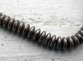 CzechMates Two Hole Lentils - Grey Brown 6mm, 1 sträng CzechMates
