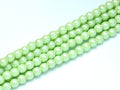 Tjeckiska Pearl Shell - Mint Green 2mm, 1 sträng
